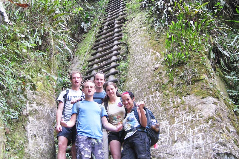 People climbing Putucusi Mountain