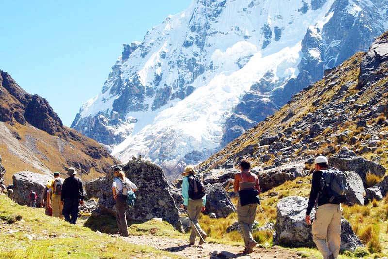 Tourists passing through the Salkantay snow-capped mountain