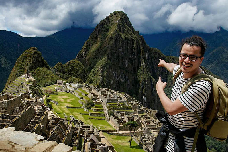 Machu Picchu afternoon shift Happy tourist in Machu Picchu