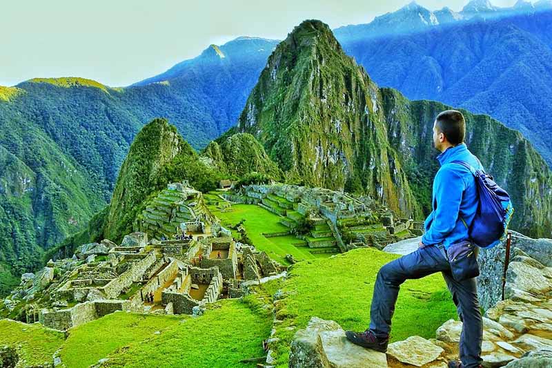 Macchu Picchu Tourist in Machu Picchu at sunrise