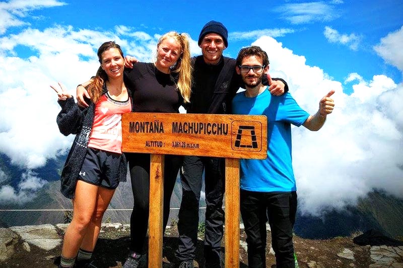 Tourists at the top of Machu Picchu Mountain