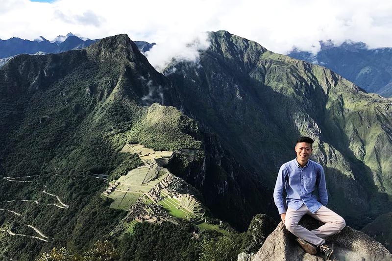 Visitor at the top of Huayna Picchu Mountain