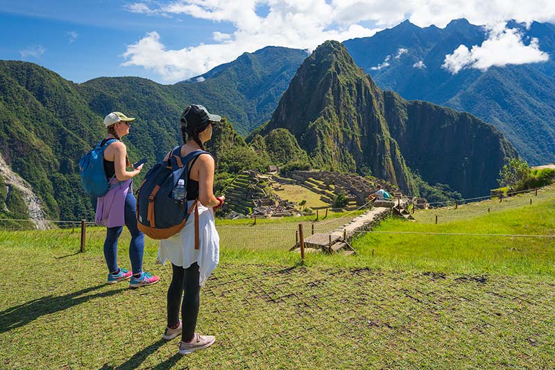 Friends observing the Inca city of Machu Picchu