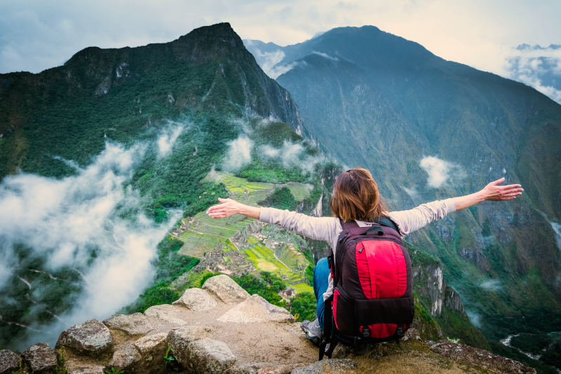 Tourist at the top of Huayna Picchu mountain