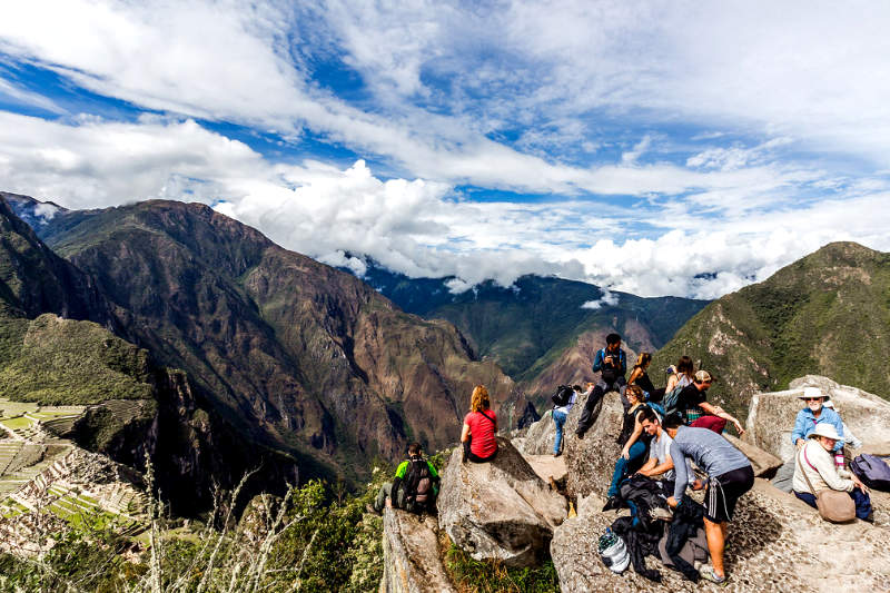 Tourists at the top of Huayna Picchu Mountain